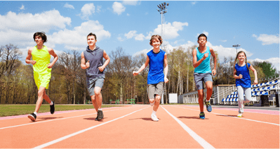 boys running in a school track