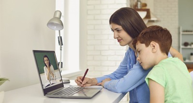 a mother and her son talking to doctor online