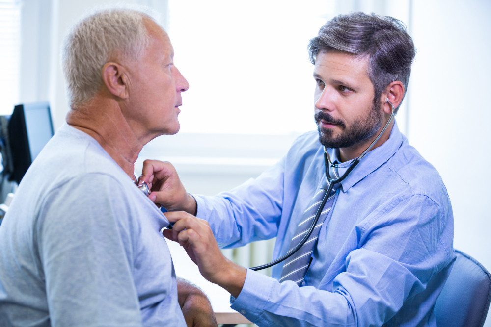 male doctor examining-patient.