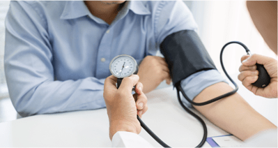 a man getting his blood pressure checked