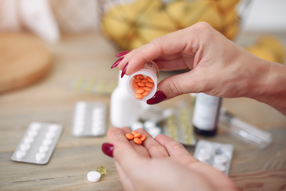 woman pouring out medication